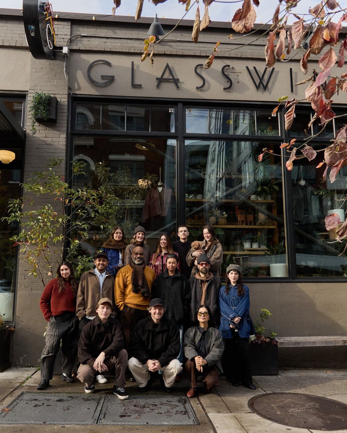 The Glasswing team poses in front of their store.